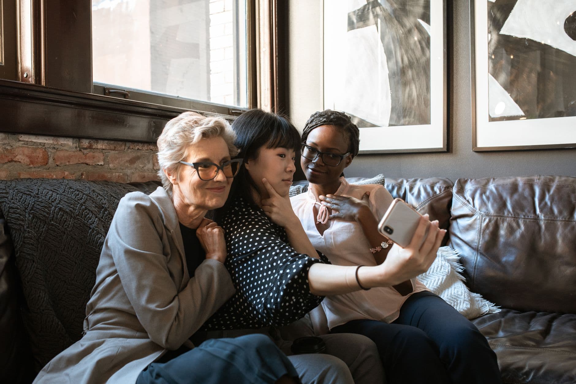 Three women of different ages and backgrounds together, the warmth of the Mental Wealth Collective